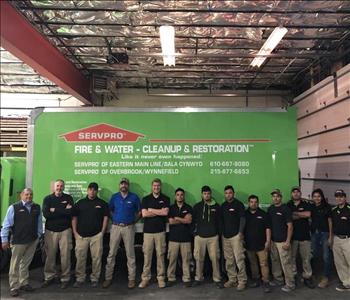 Owner Vince Fabiani standing in front of our box truck with our crew 